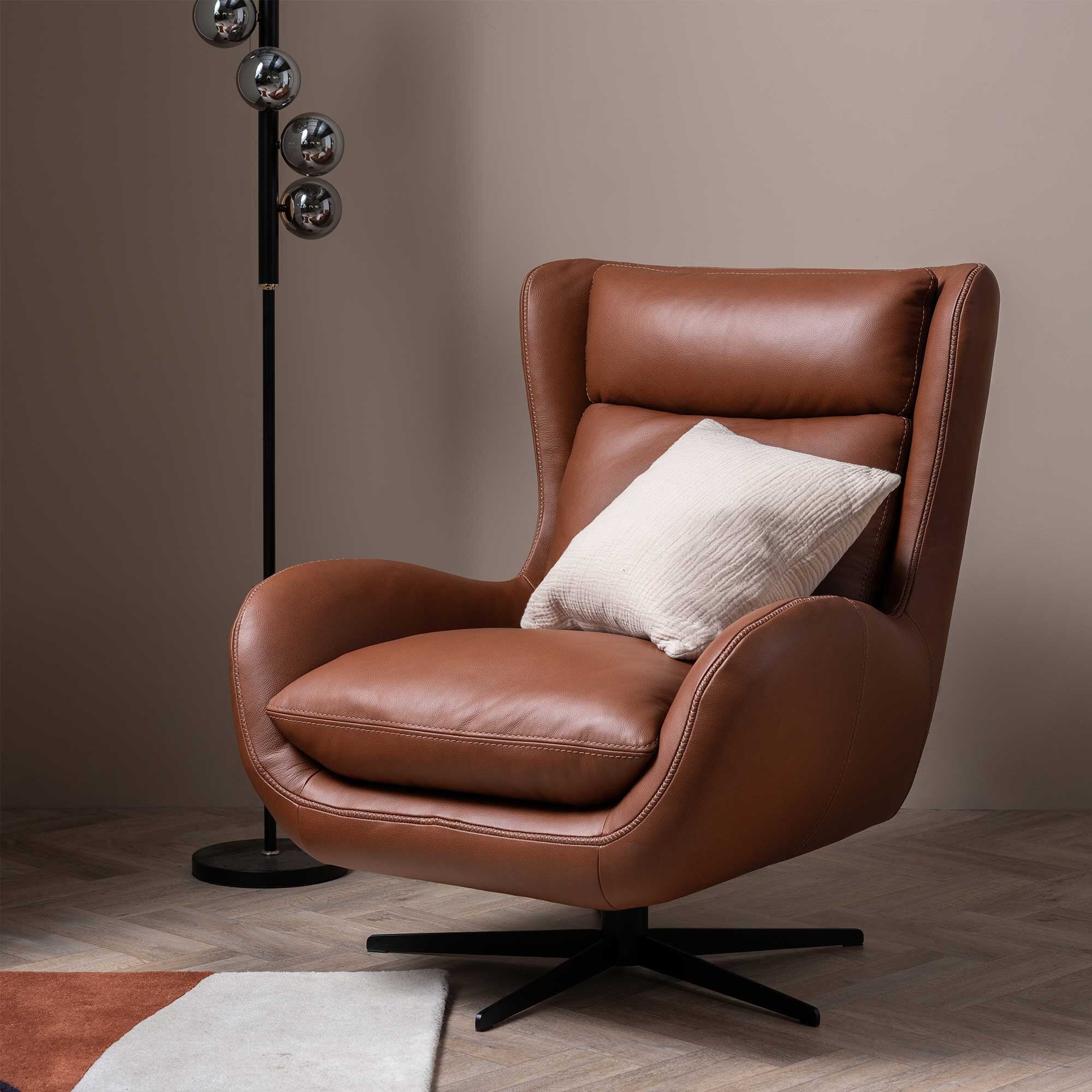 Uma swivel armchair in brown leather