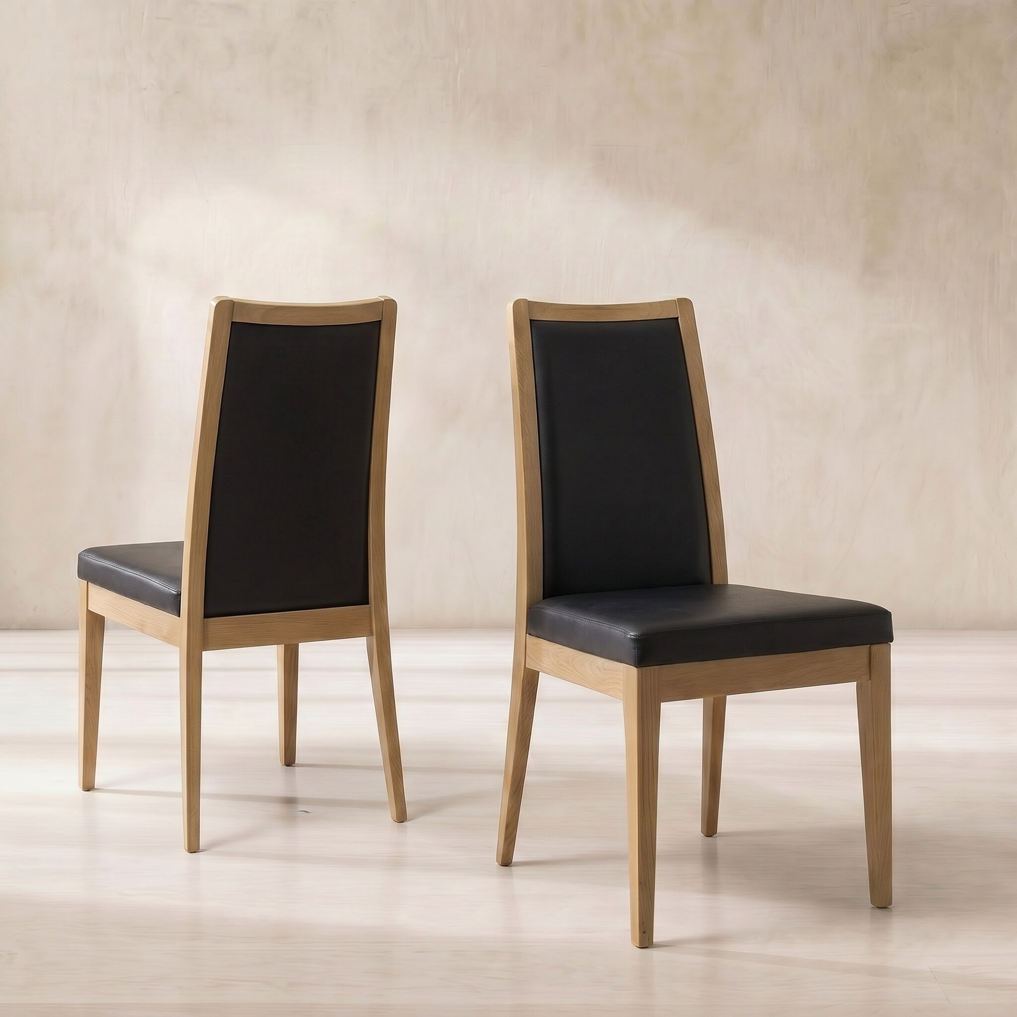 Ercol romana padded back dining chair in black leather