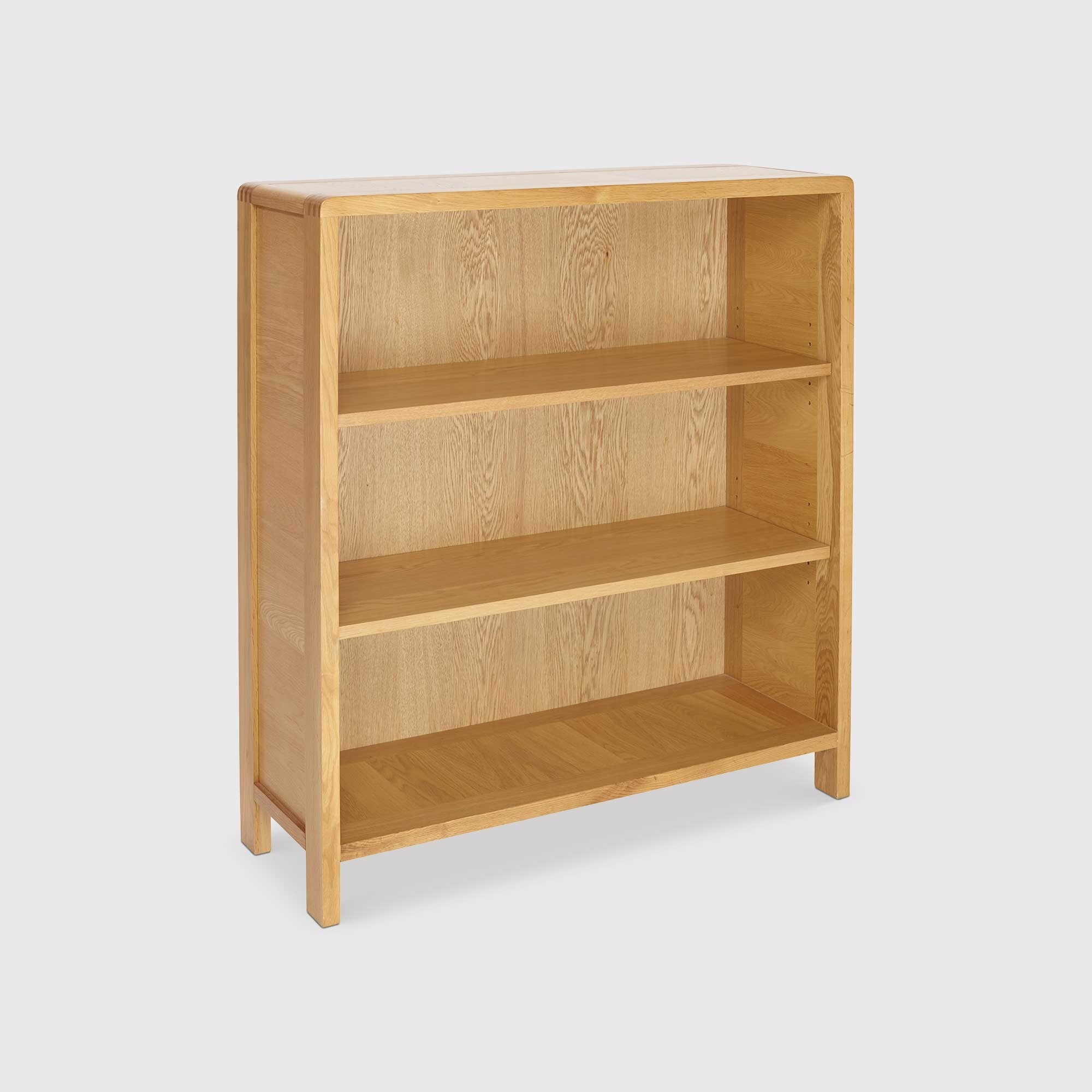 Ercol bosco low bookcase in brown oak
