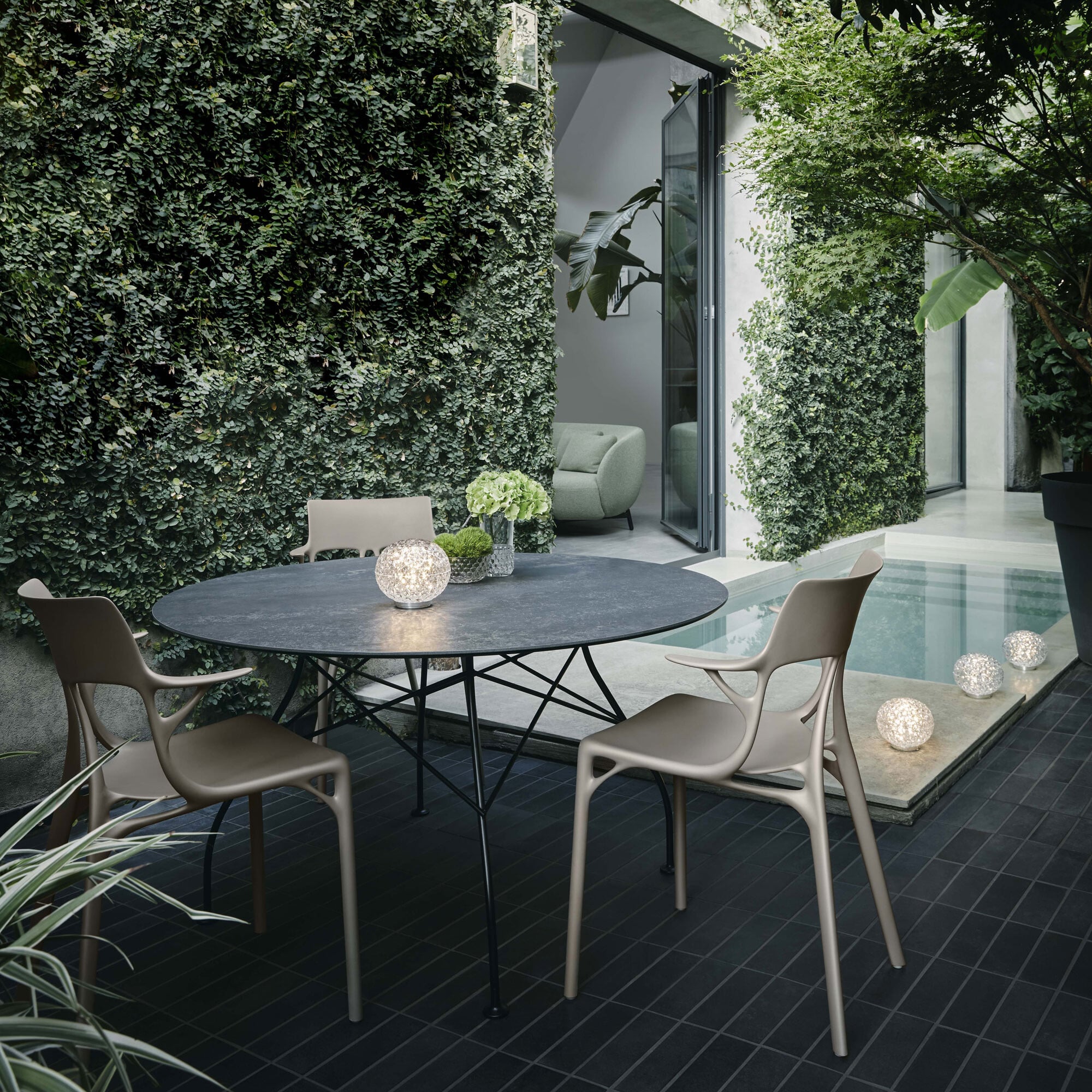 View Kartell glossy 128cm round dining table in round in black stone View Kartell glossy 128cm round dining table in round in black stone