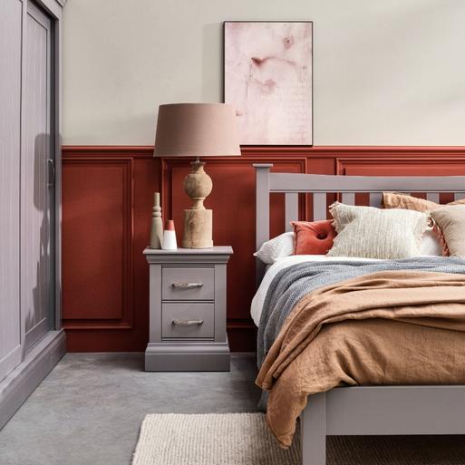 Grey bed with brown furniture store