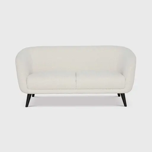 White couch with 2025 wooden legs